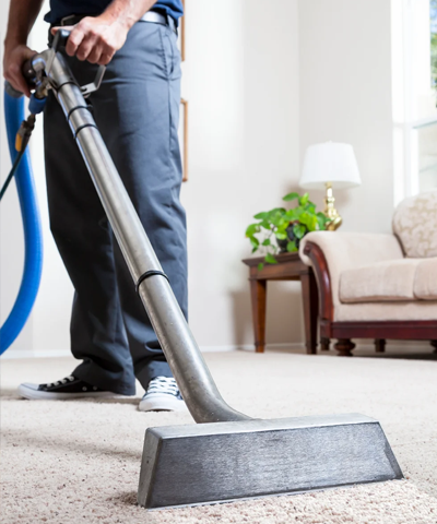 Man Cleaning Carpet with pressure washer