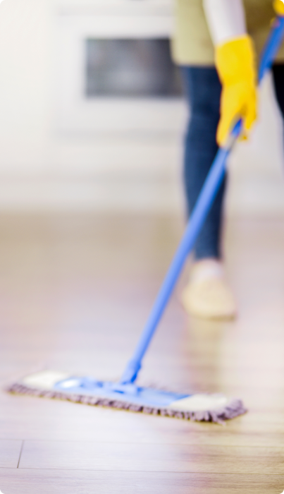 Blurry image of girl mopping the floor
